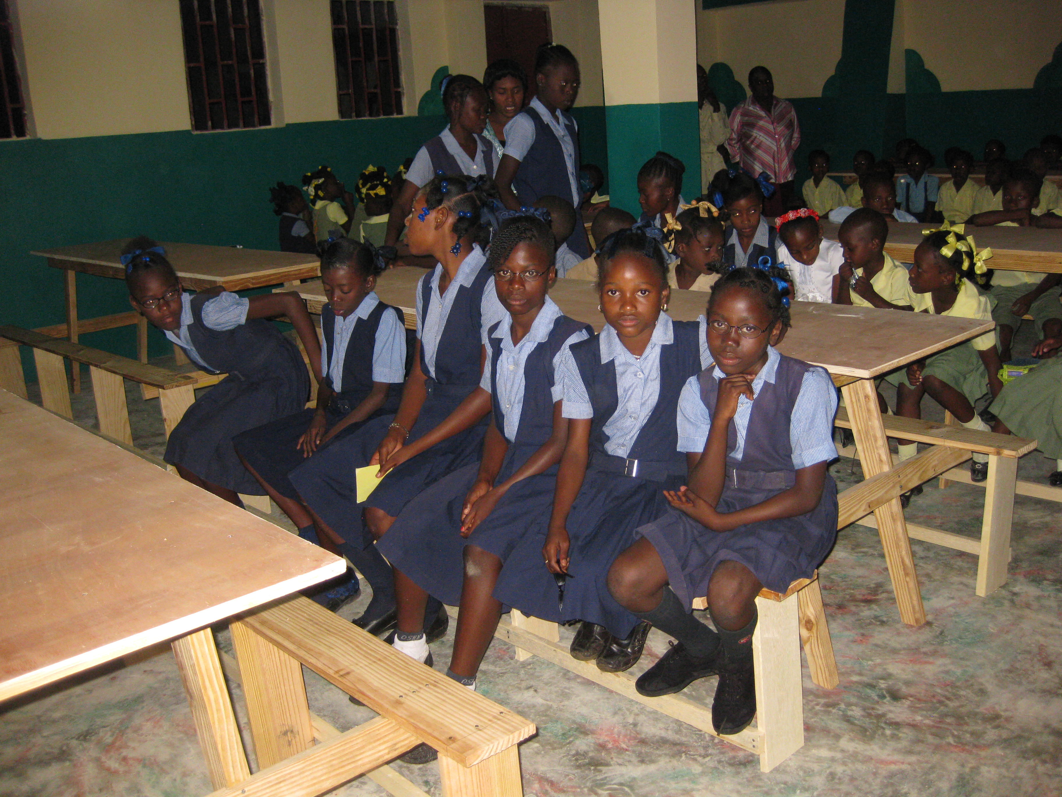 Young Haitian girls at a school table
